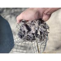 Clogged lint and debris trapped inside of a dryer vent screen. 